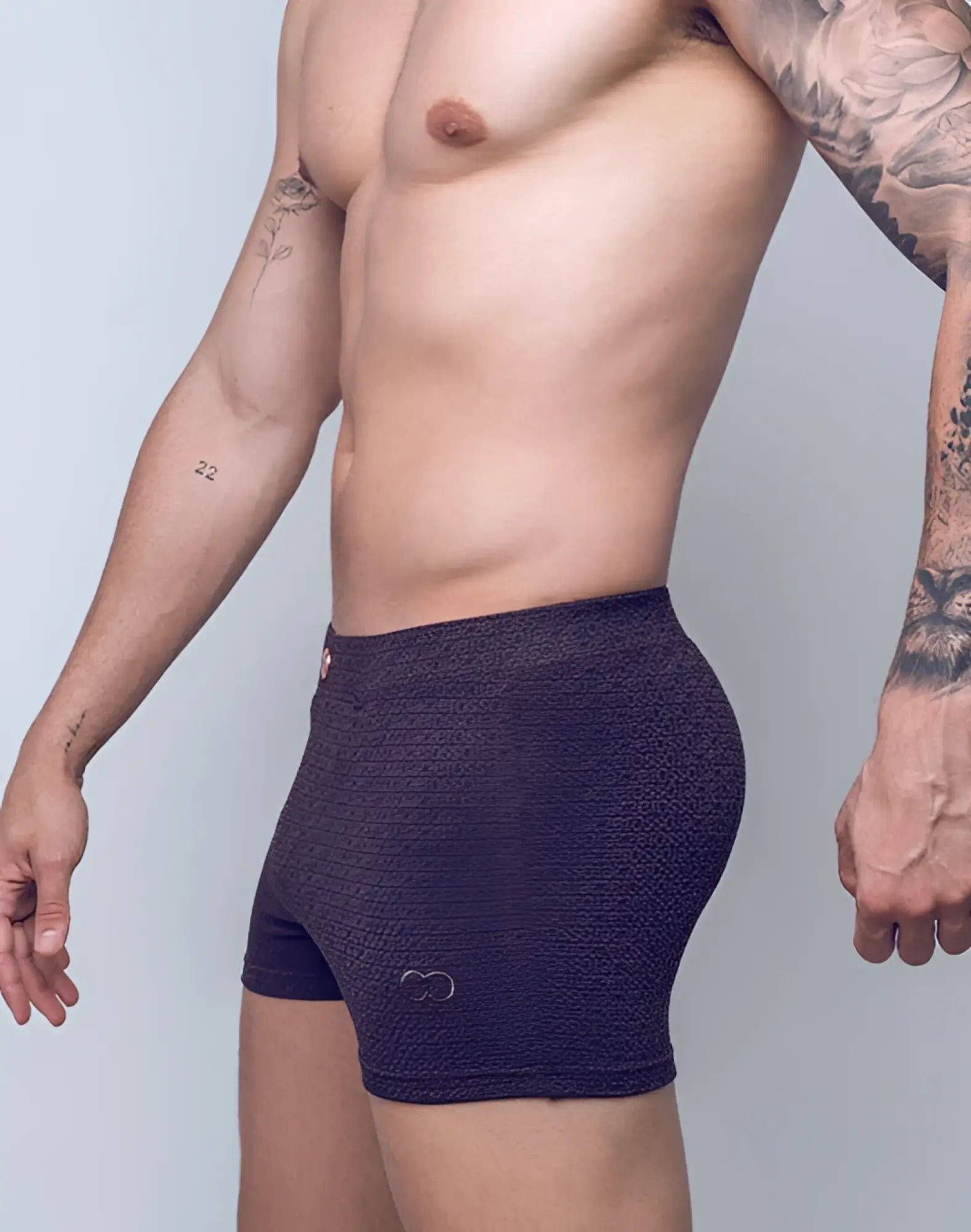 Dark purple textured boxer briefs with subtle pattern and small logo on lower right leg by 2eros v60