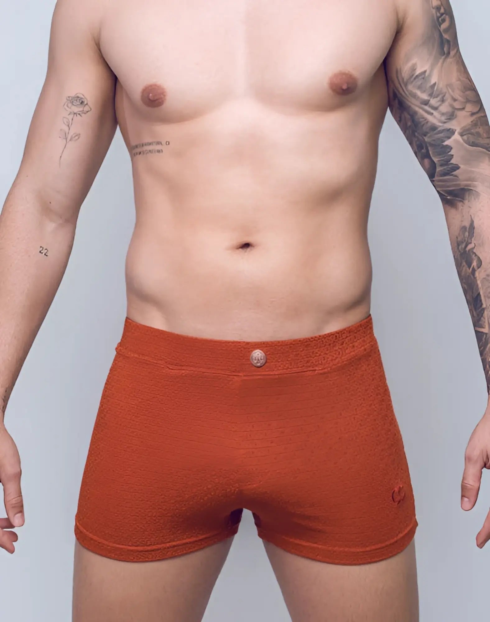 2eros v60 textured swim trunk in signet carmine orange briefs with metallic button closure and subtle brand logo on side