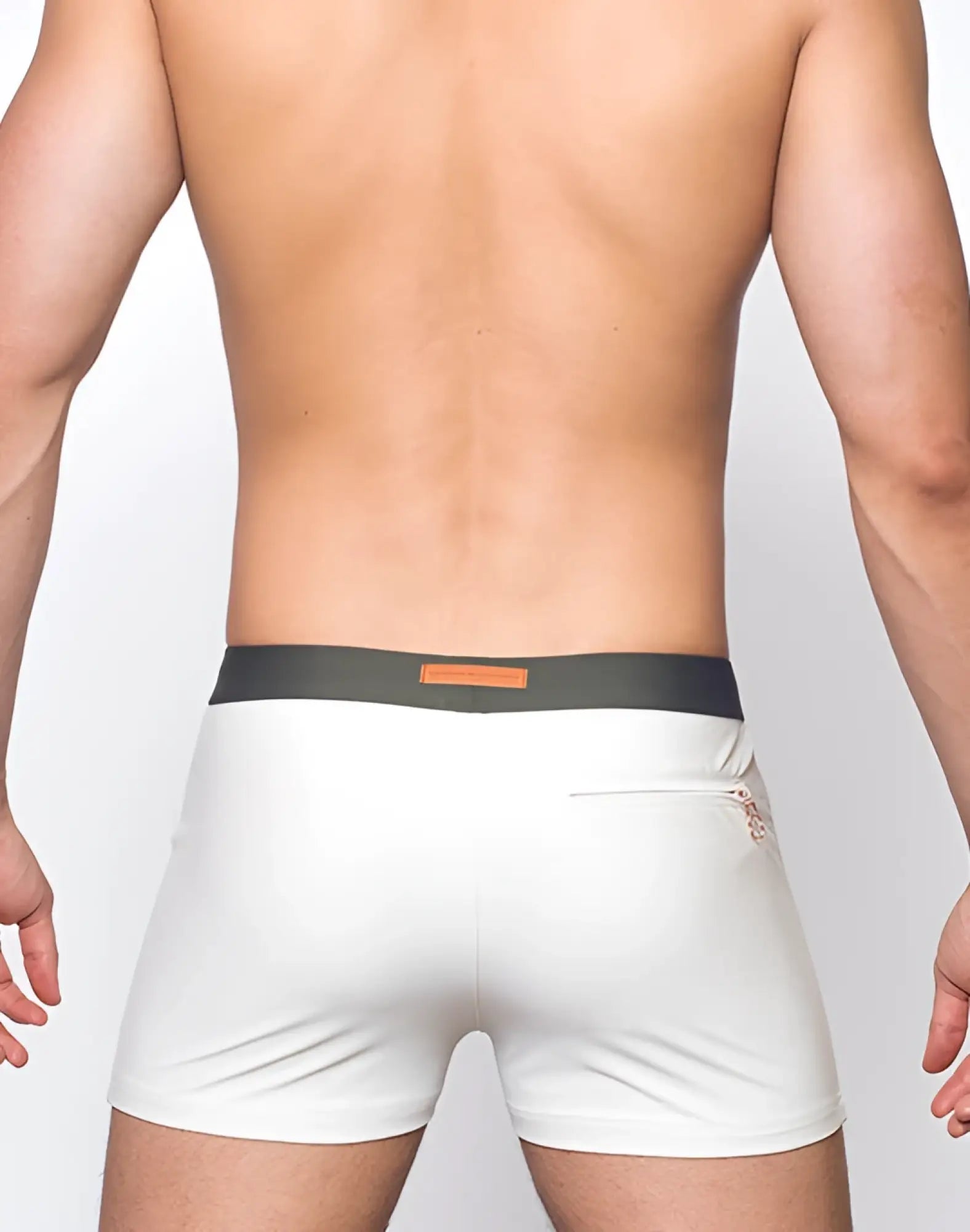2EROS V65 swim trunks in white briefs with dark gray waistband and orange rectangular label front view
