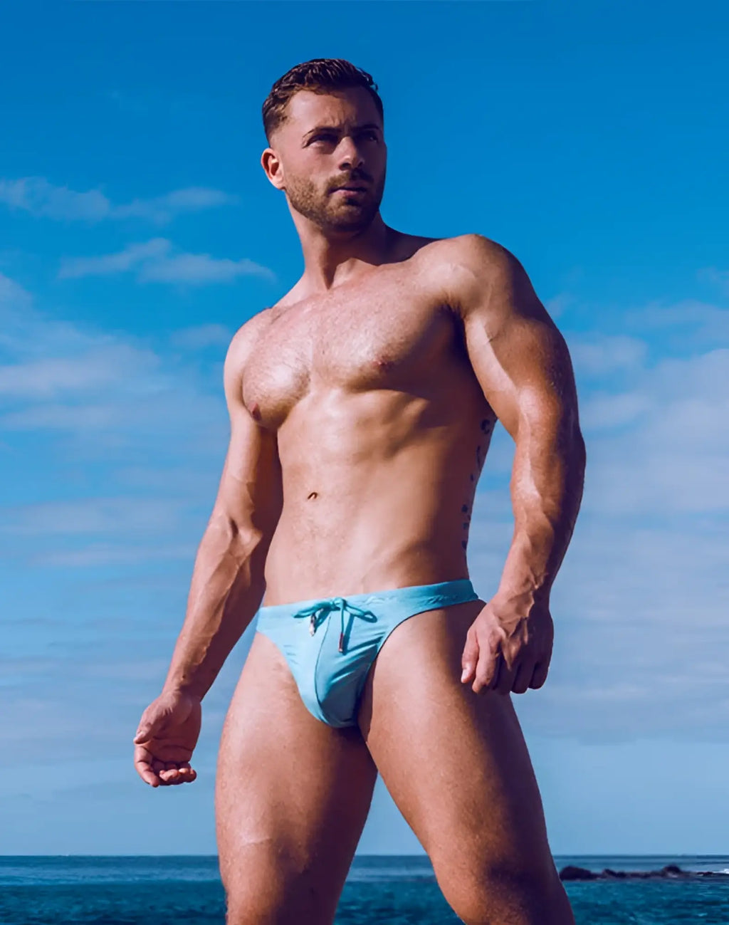 Light blue 2EROS V80 print swim thong with drawstring waistband designed for swimming and beachwear