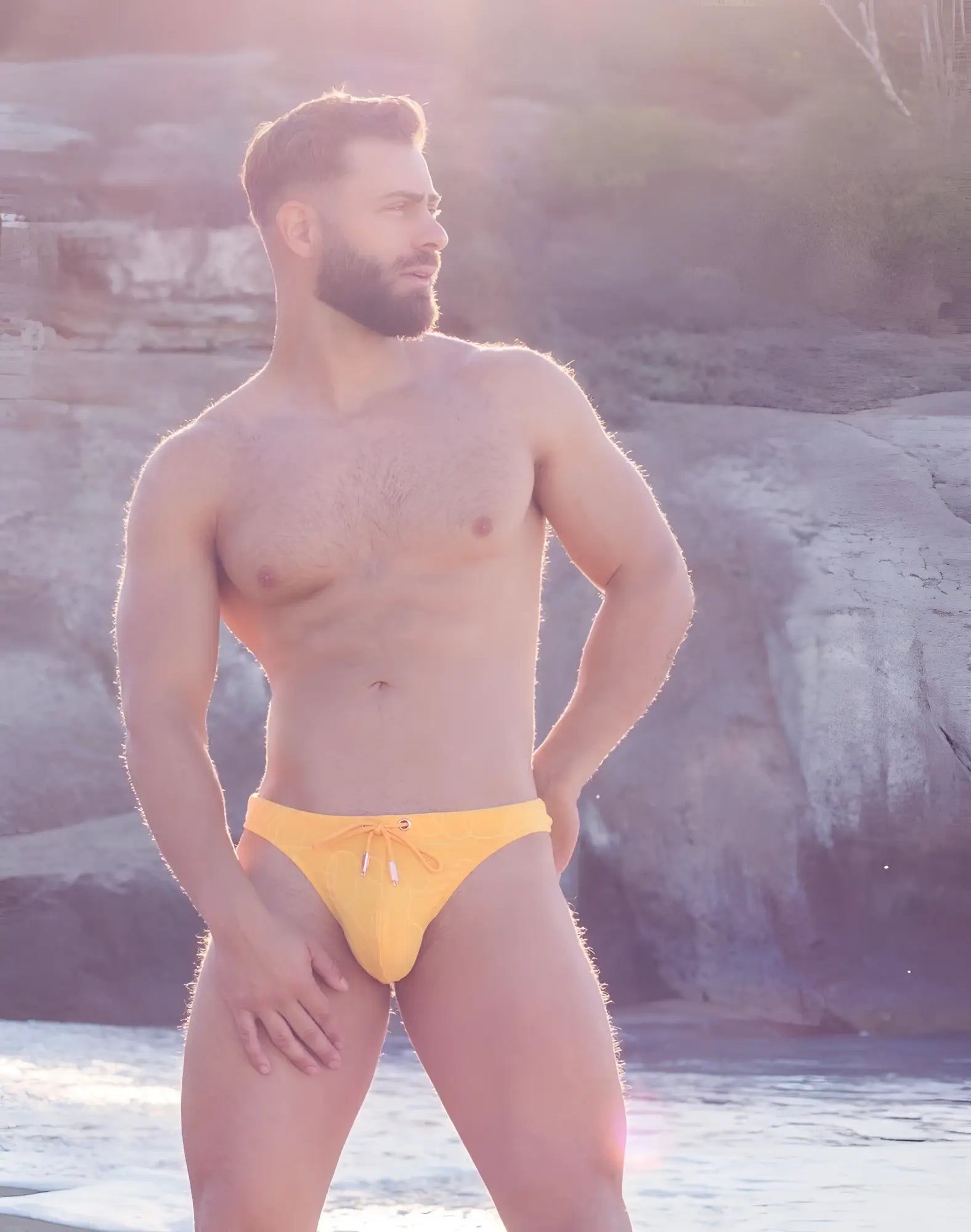 Bright yellow 2EROS V80 textured swim thong featuring a ripple pattern and a drawstring waistband