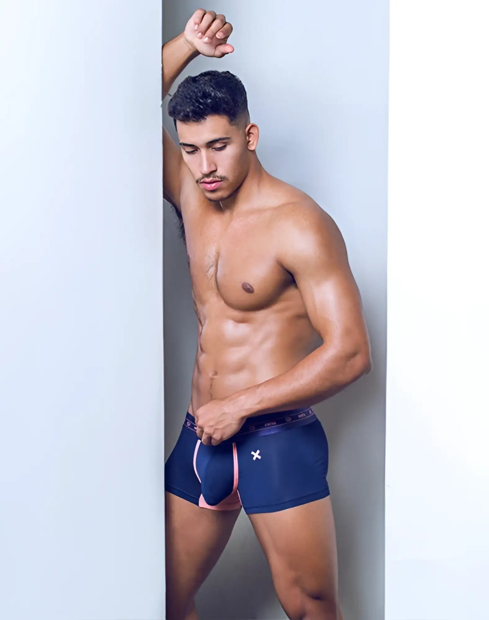 Navy blue 2EROS X-Series trunk underwear with pink trim and a white x logo on the waistband in midnight color