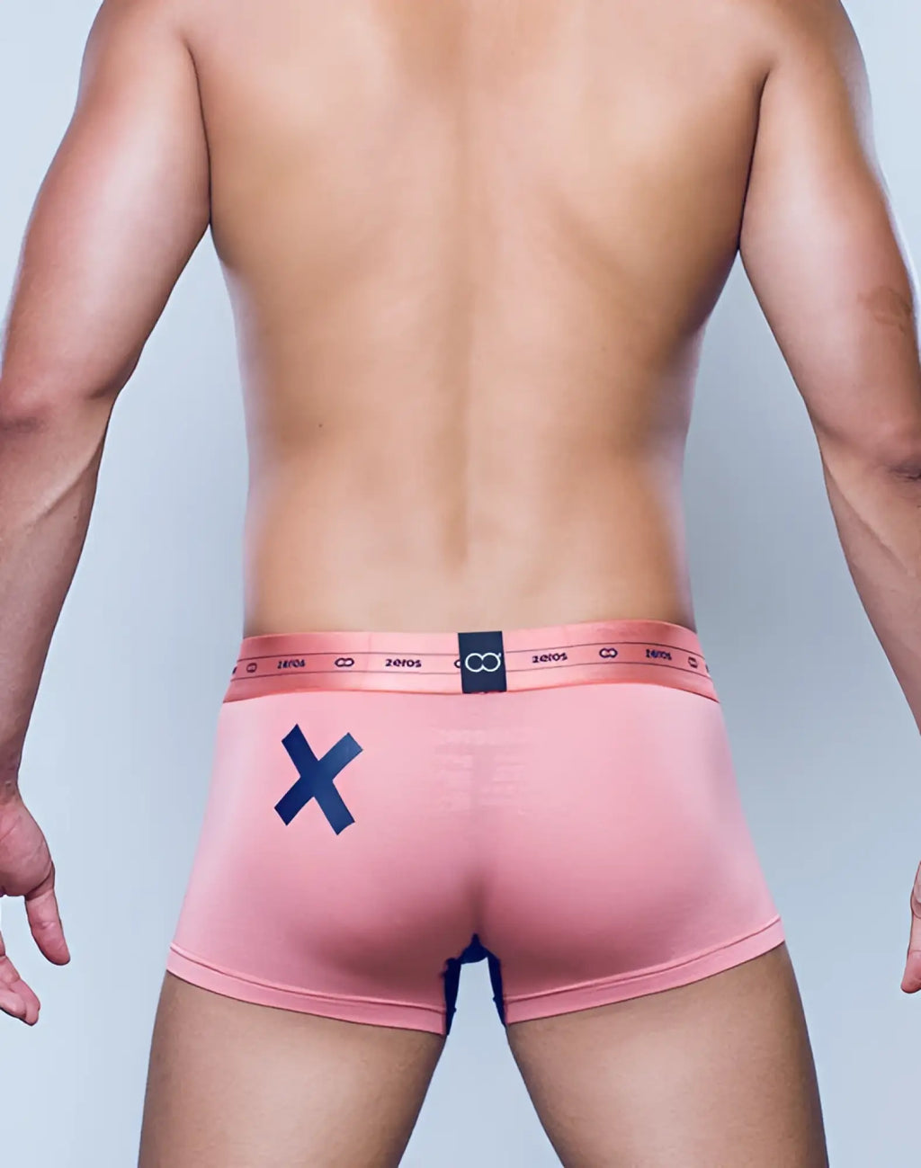 Back side of 2eros x-series trunk underwear in rose gold pink with navy x and elastic waistband with 20105 text and logo