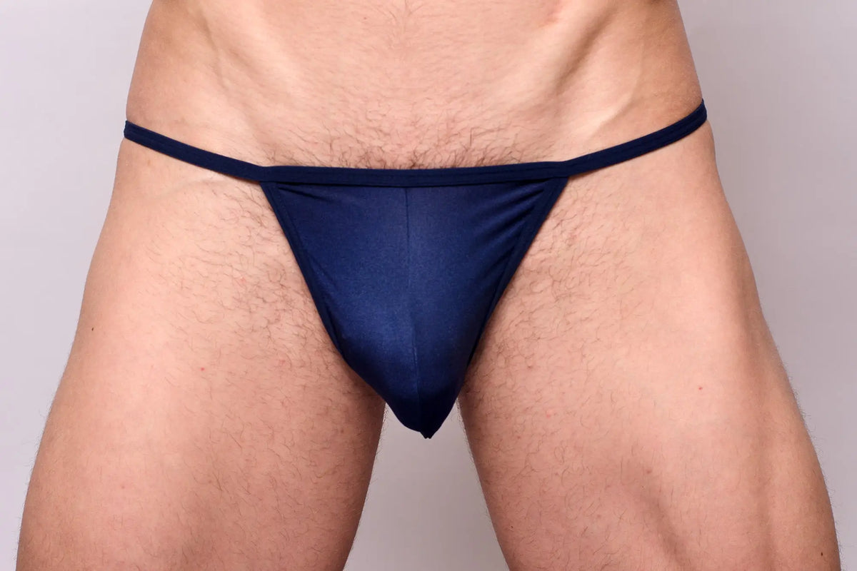 Navy blue thong from a pride metro string bikini 3-pack made of smooth stretchable fabric with minimal coverage.