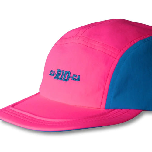 Bright pink cap with blue side panels and small embroidered lettering.