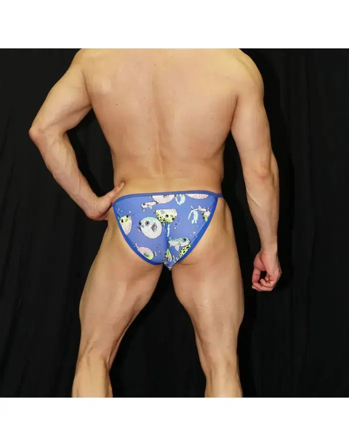 Men's bikini swimwear in blue with marine print featuring a snug fit shown on a model from the back by Arroyman.