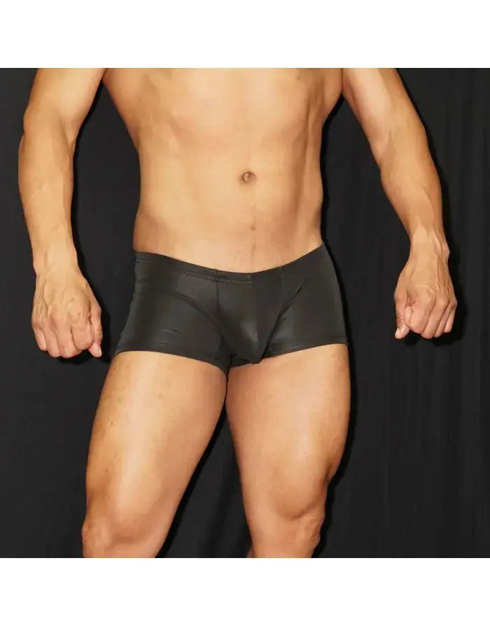 Black eco-leather men's boxer underwear by Arroyman featuring a snug fit and smooth texture shown on a model.