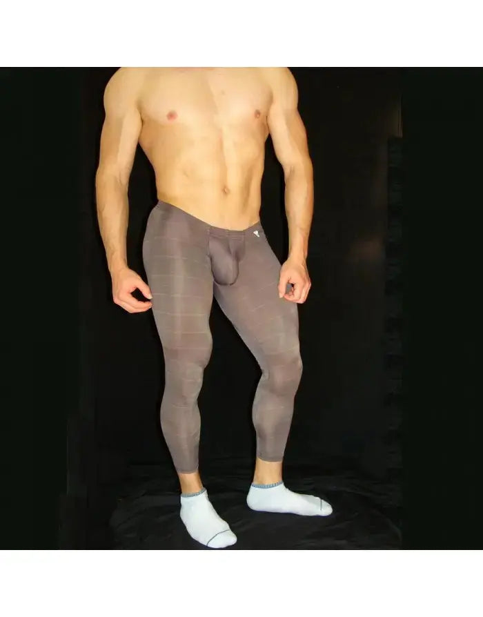 Men's gym tights in a dark gray color with a fitted design made by Arroyman featuring a smooth texture and subtle stripe pattern.