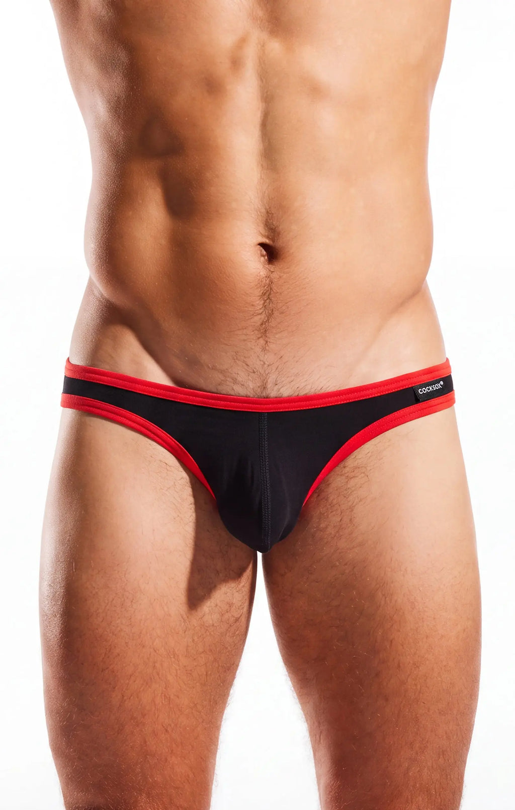Torso and thighs of a person wearing black briefs with red trim on a white background.