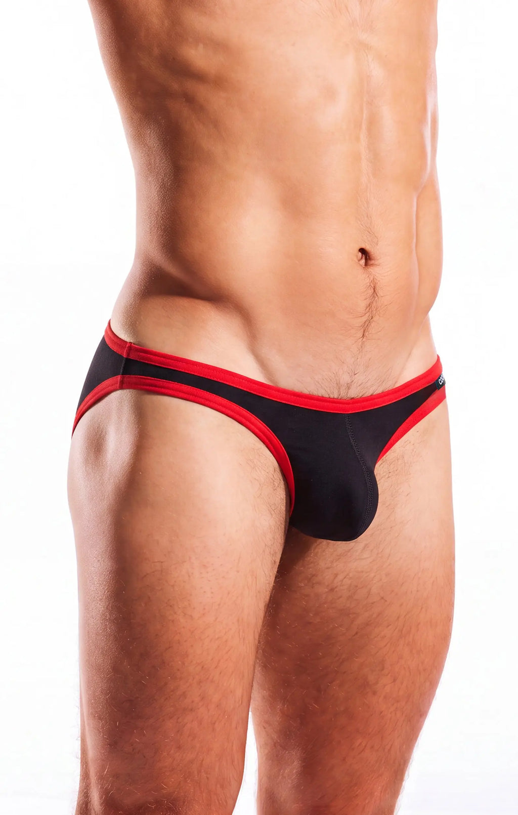 Torso and thighs of a person wearing black briefs with red trim, against a white background.