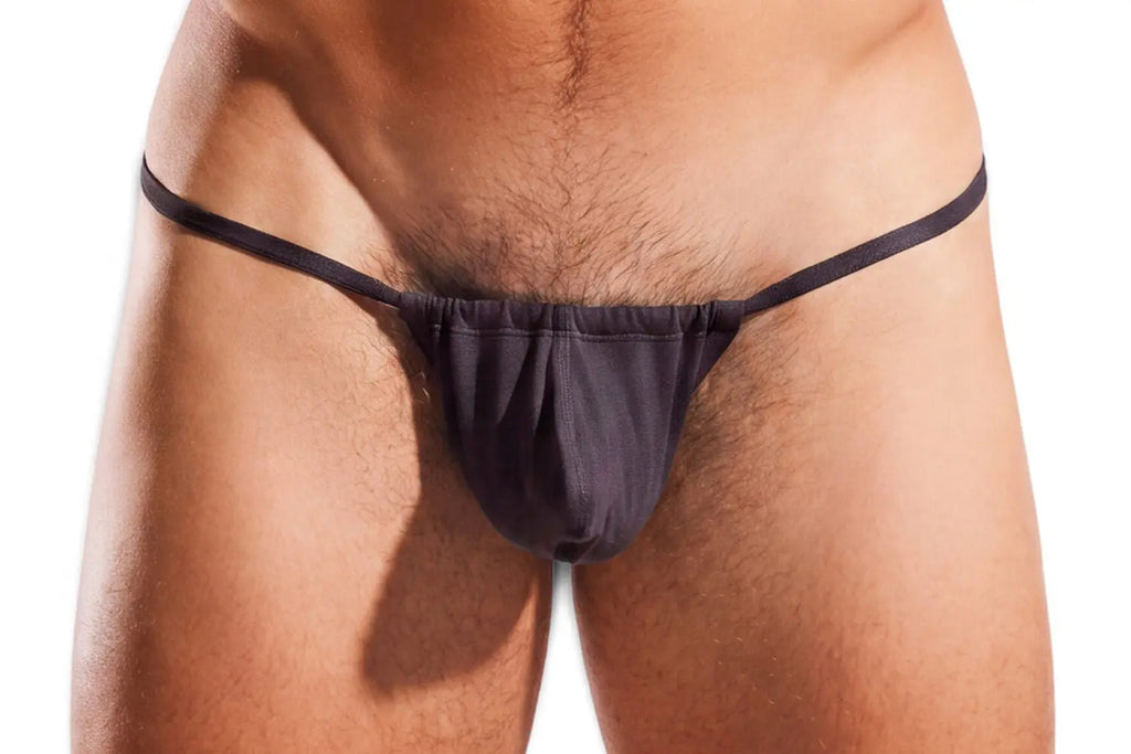 Close-up of a person's lower torso wearing black underwear against a white background.