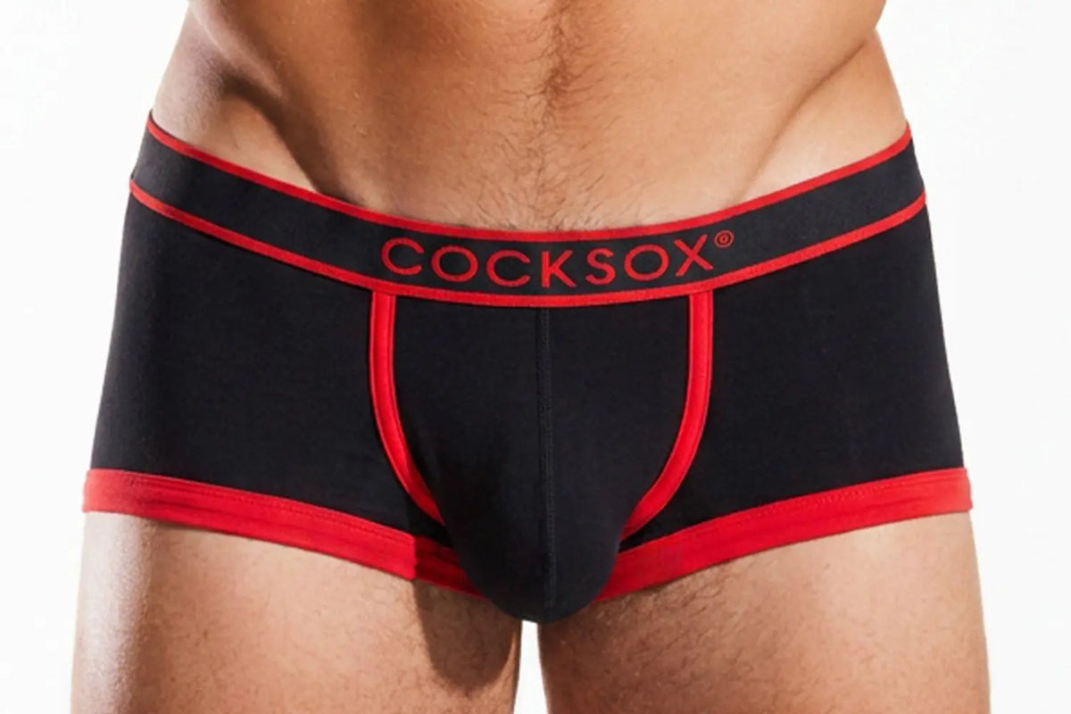 Black boxer briefs with red trim and a red waistband on a person.