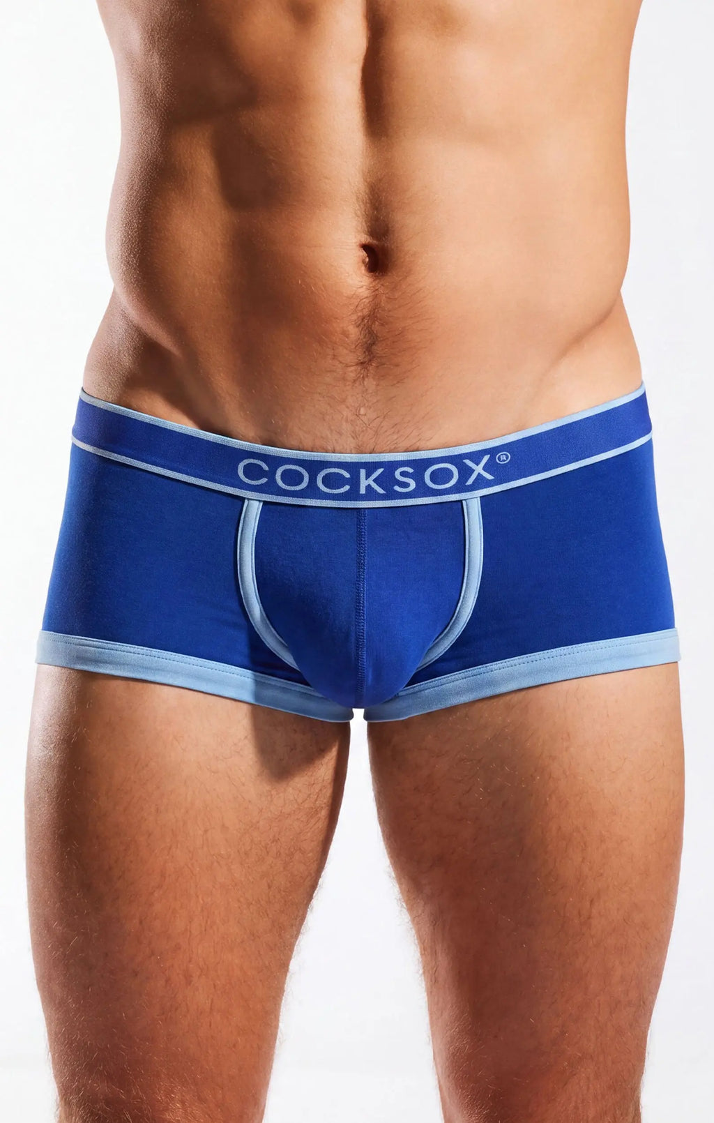Torso and thighs of a person wearing blue trunks with a light blue waistband.
