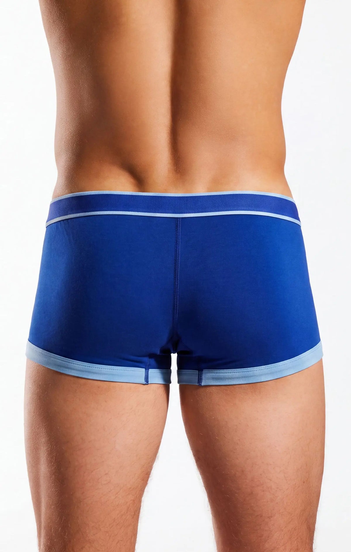 Rear view of a person wearing blue fitted shorts with light blue trim on a white background.