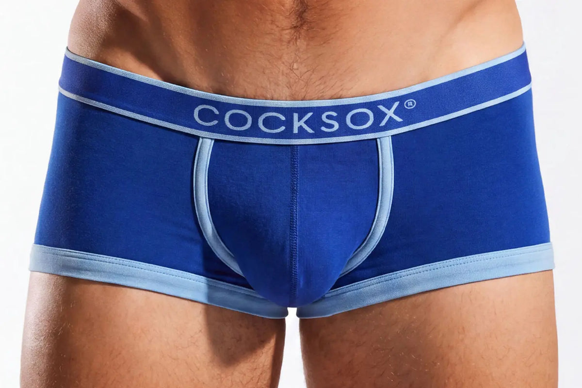 Close-up of blue underwear with a light blue waistband on a person.