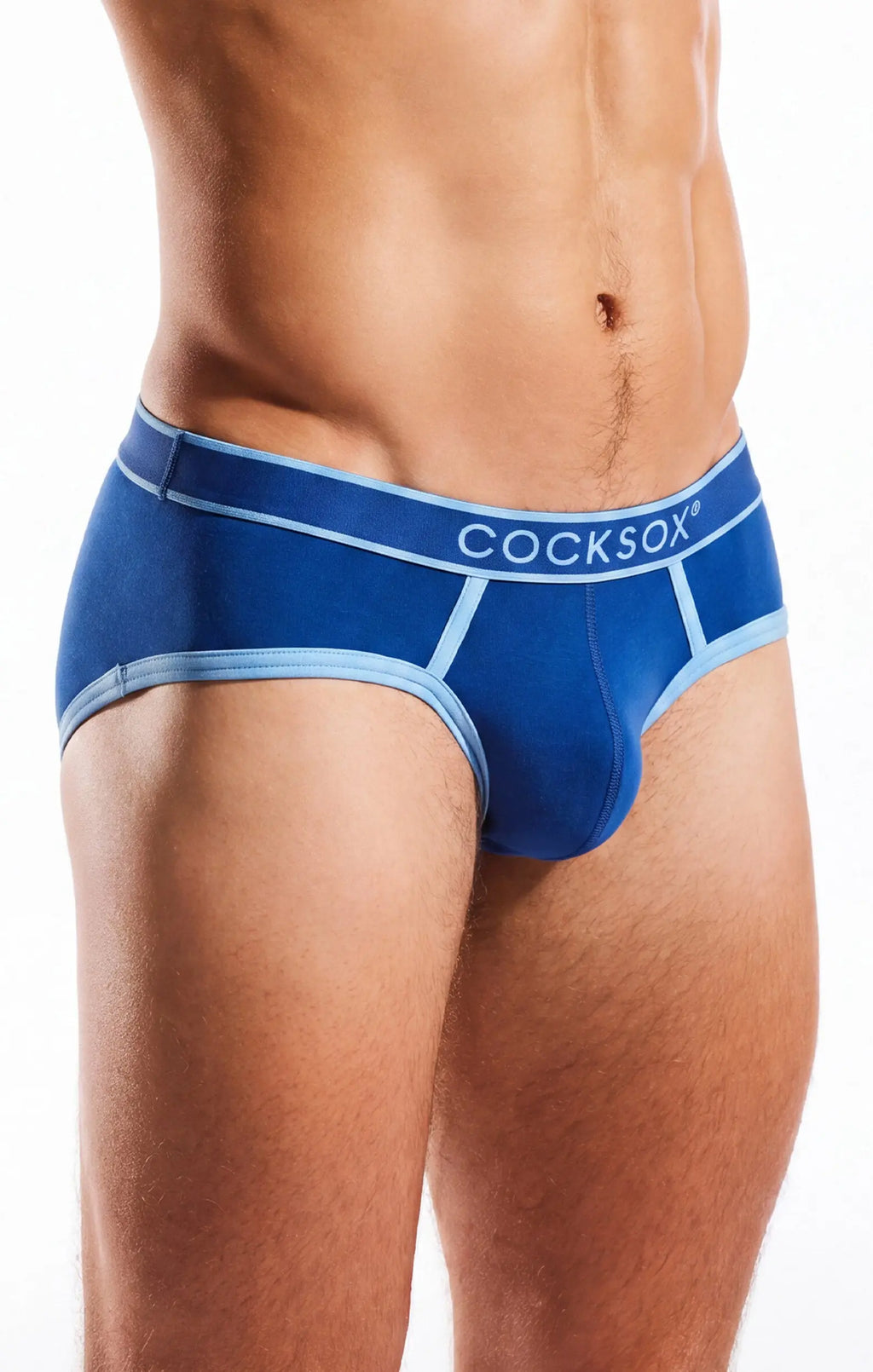 Torso and thighs of a person wearing blue briefs with light blue trim on a white background.