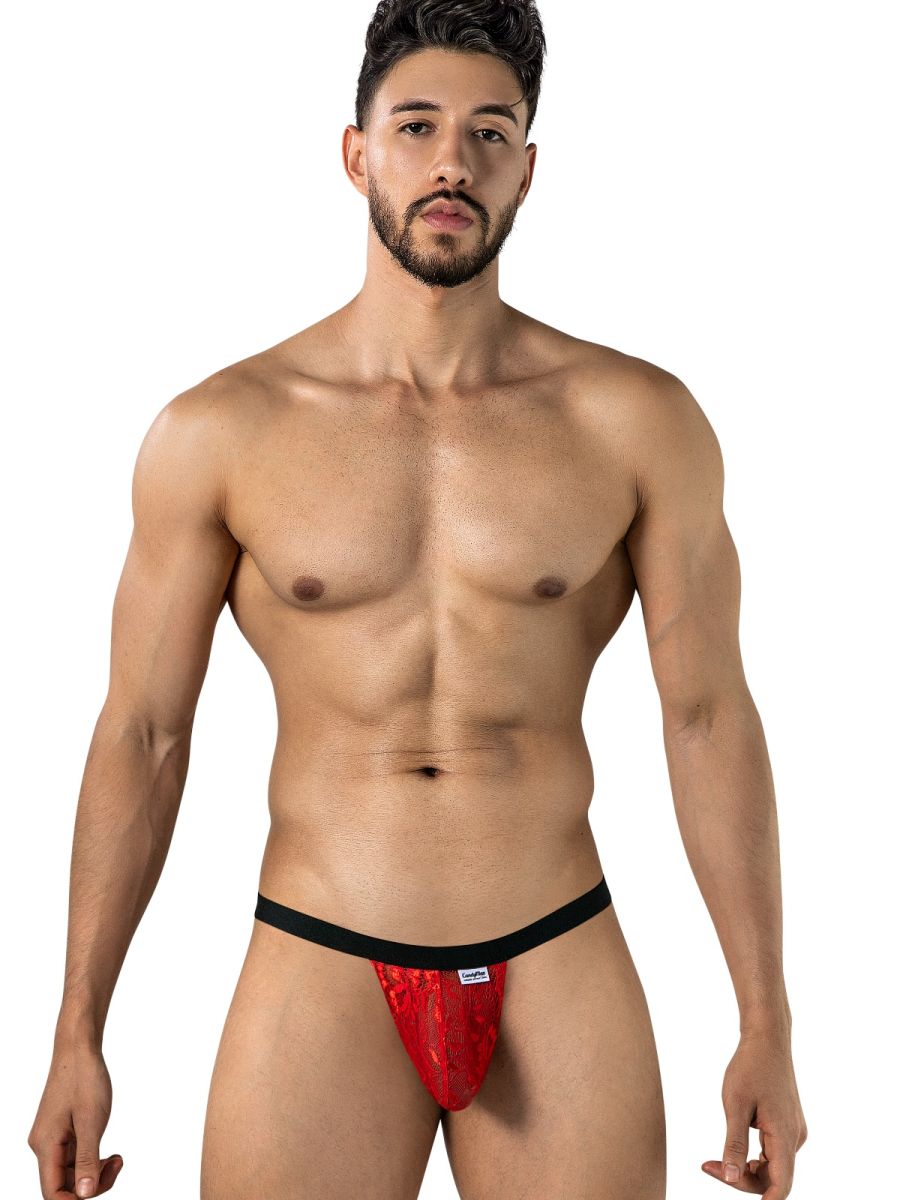 CandyMan red lace thong with black waistband worn by a male model.