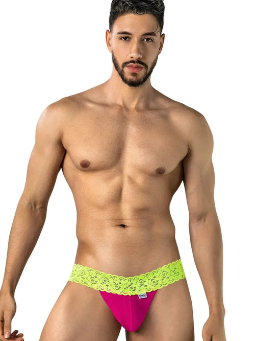 Man in pink and green underwear against a white background.