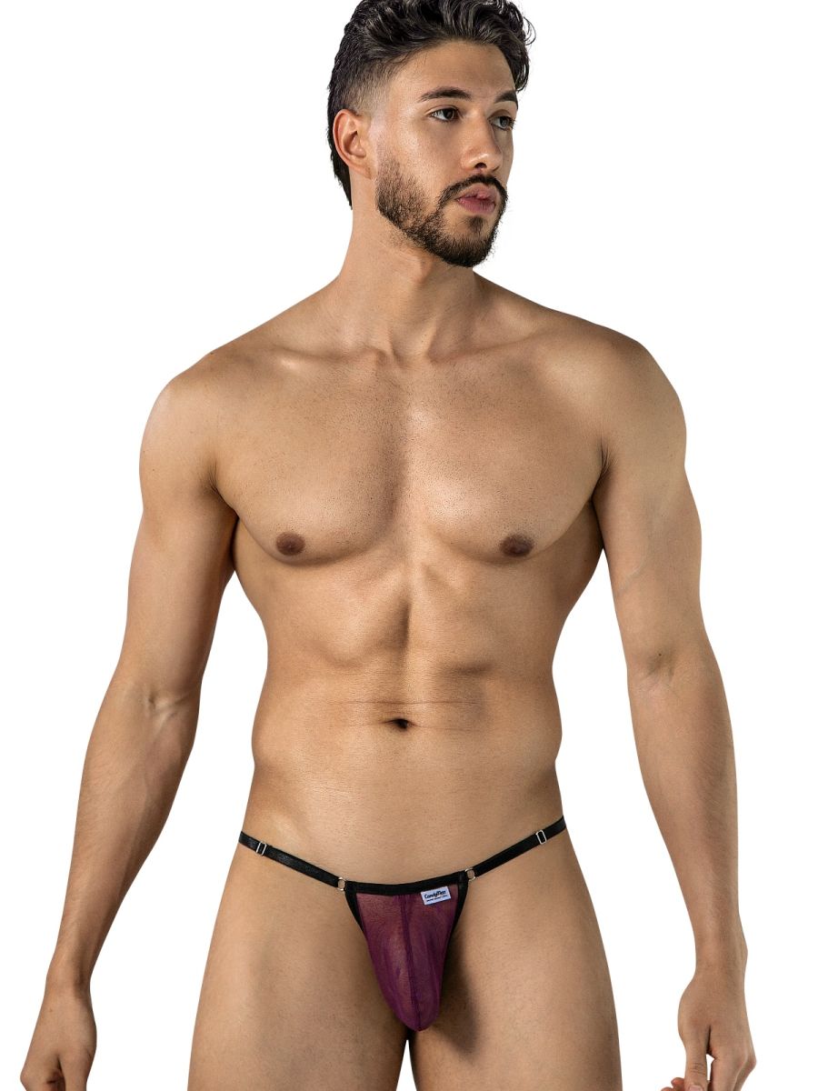 Man wearing wine sheer mesh thong with thin side straps and metal hardware.