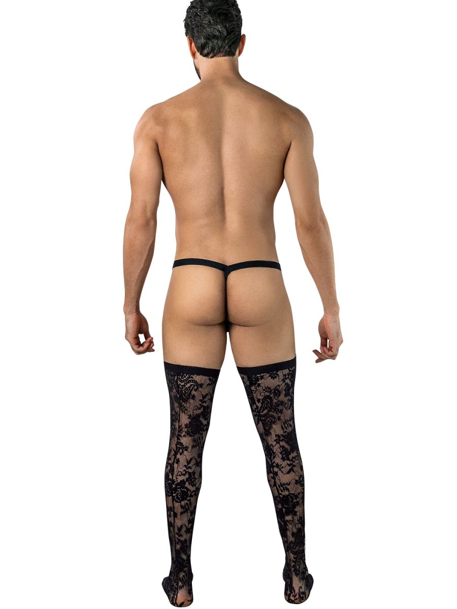 Rear view of man wearing black lace thigh-high stockings and black thong