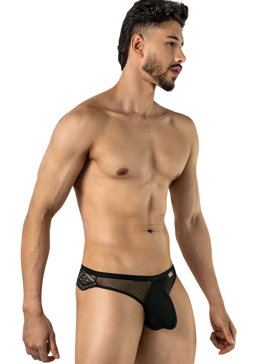 Angled front view of a model wearing a black CandyMan mesh thong with lace panels.