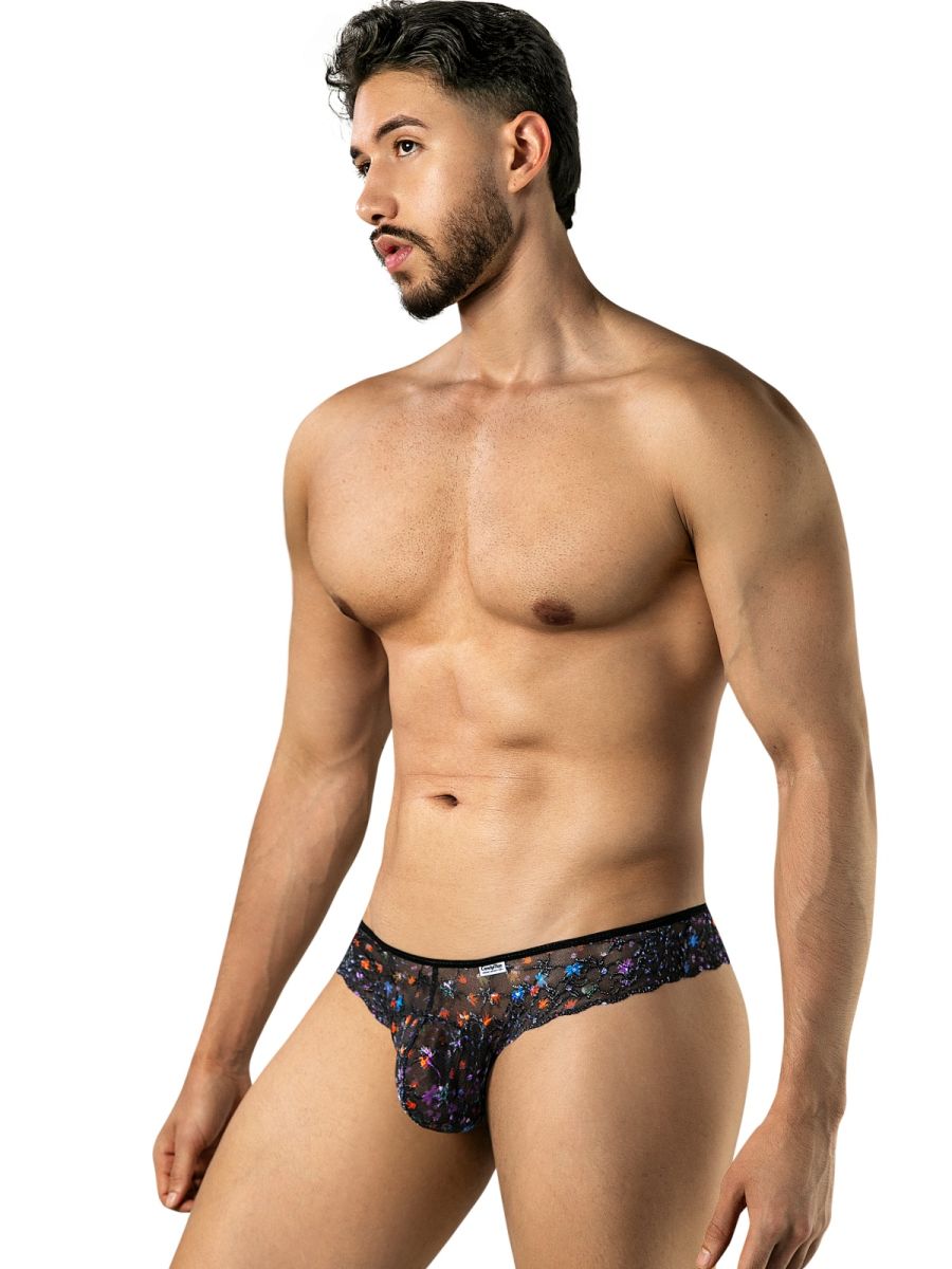 Angled front view of a model wearing a black CandyMan 99975 floral-mesh thong.