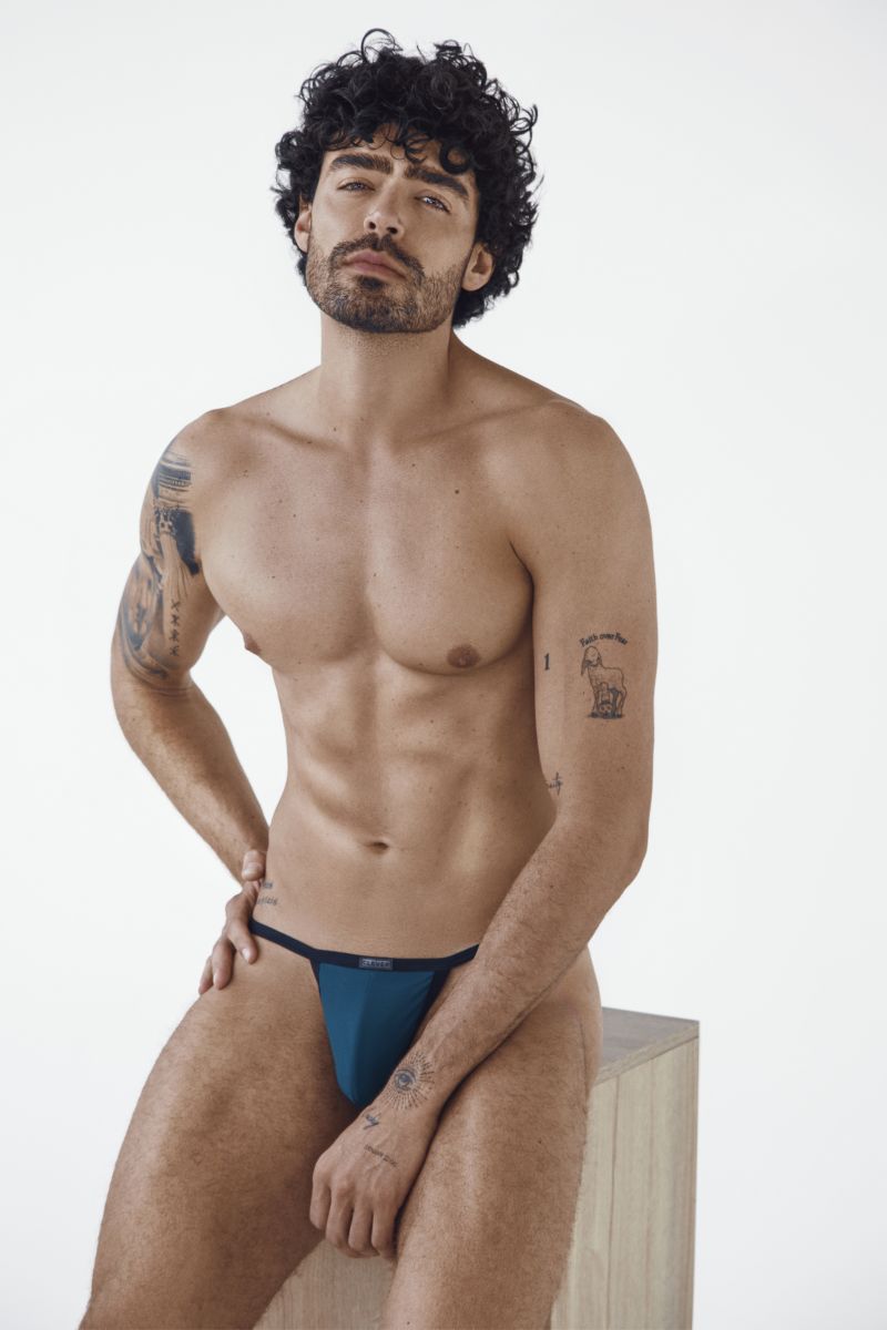 Clever Moda petrol blue sleek thong with a thin elastic waistband and minimal coverage.