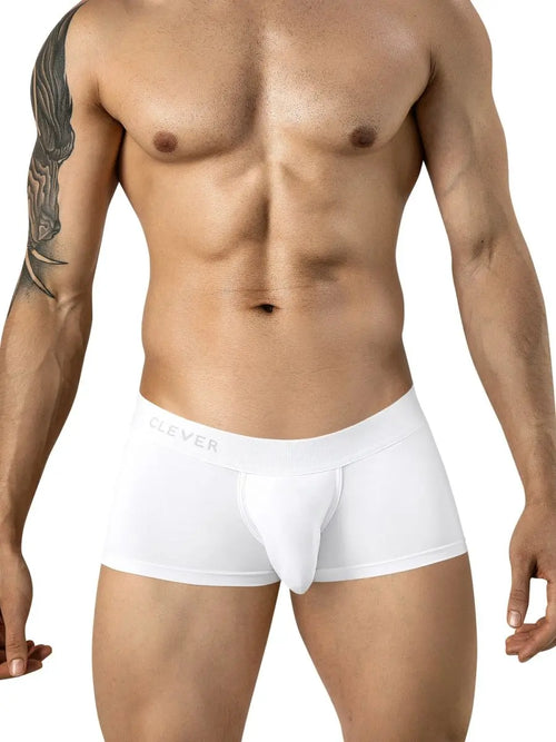 Man wearing plain white boxer briefs against a white background.