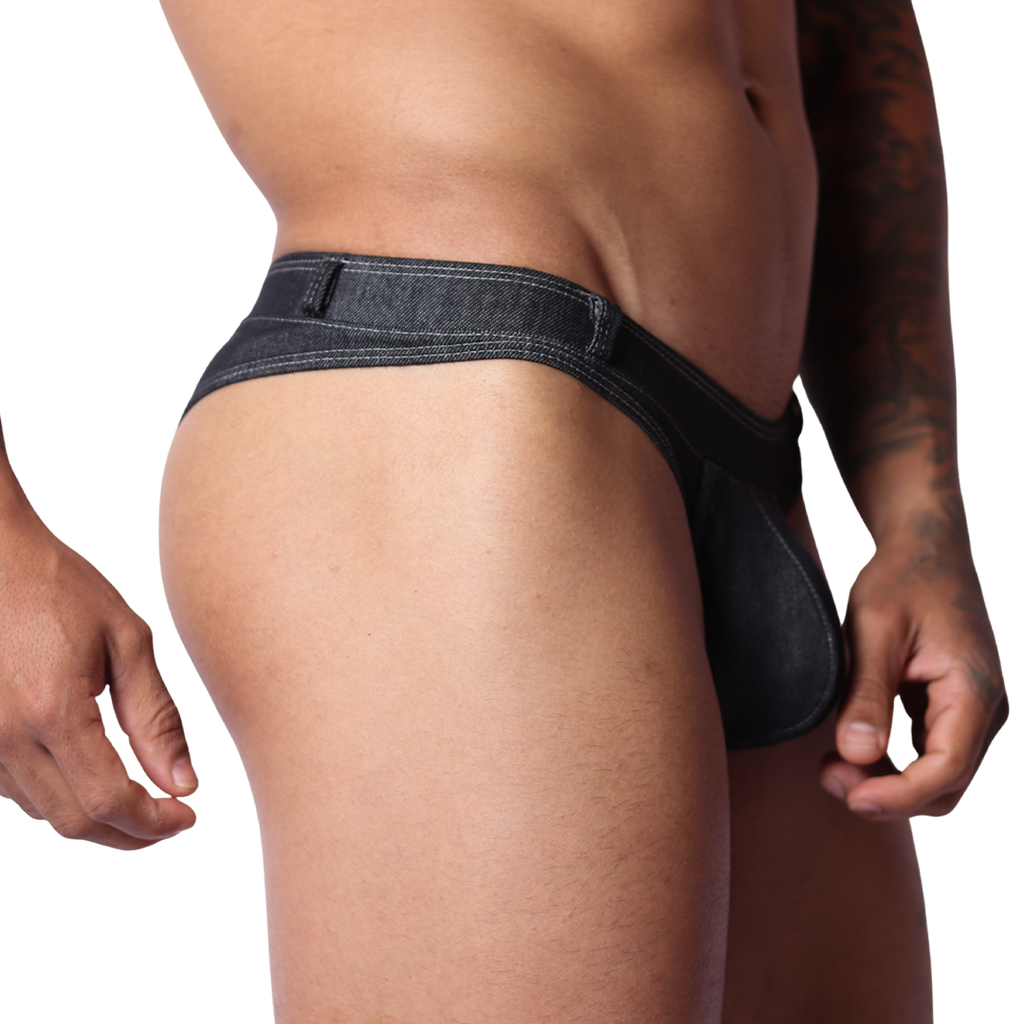 Side view of Gigo black denim G-string underwear with visible stitching and belt loop detail on a male model.