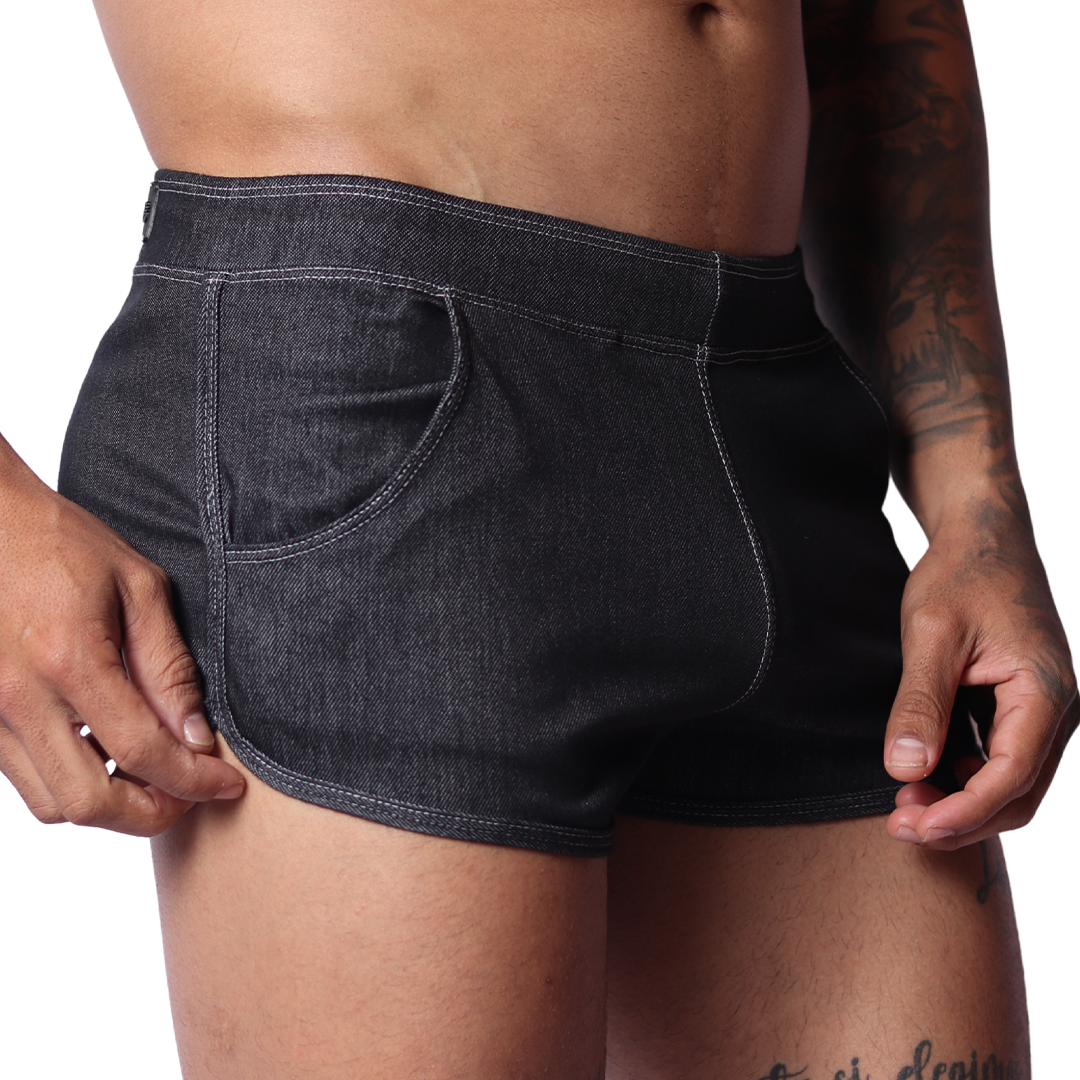 Gigo black denim hot shorts, side view, showing curved hem, white contrast stitching, and front pocket detail.