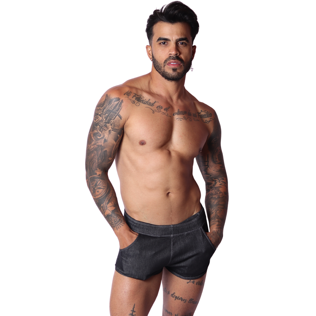 Front view of Gigo men's black denim hot shorts with pocket detailing on a tattooed model.