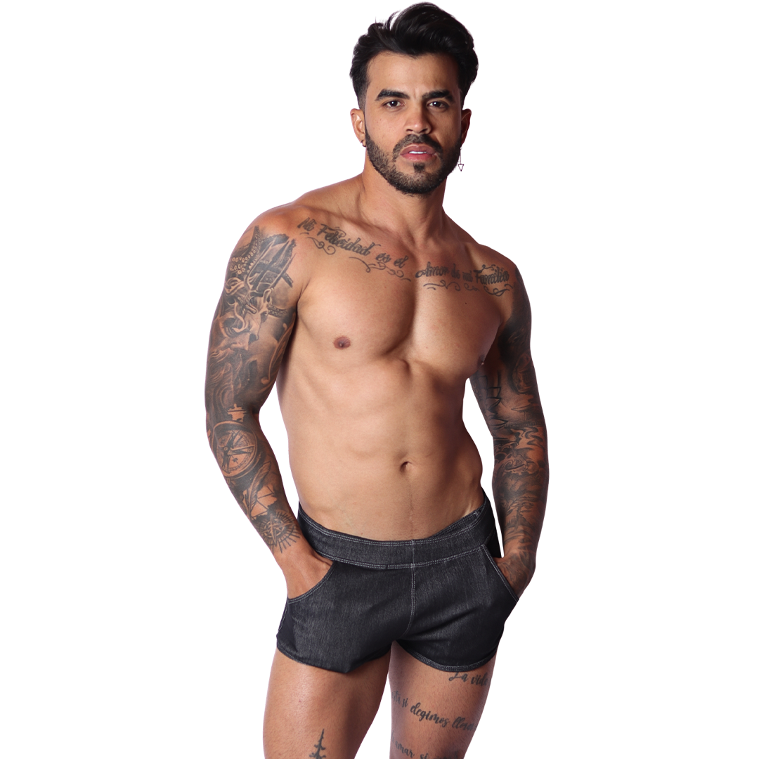 Front view of Gigo men's black denim hot shorts with pocket detailing on a tattooed model.