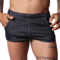 Front view of Gigo black denim hot shorts featuring white contrast stitching and side pockets.