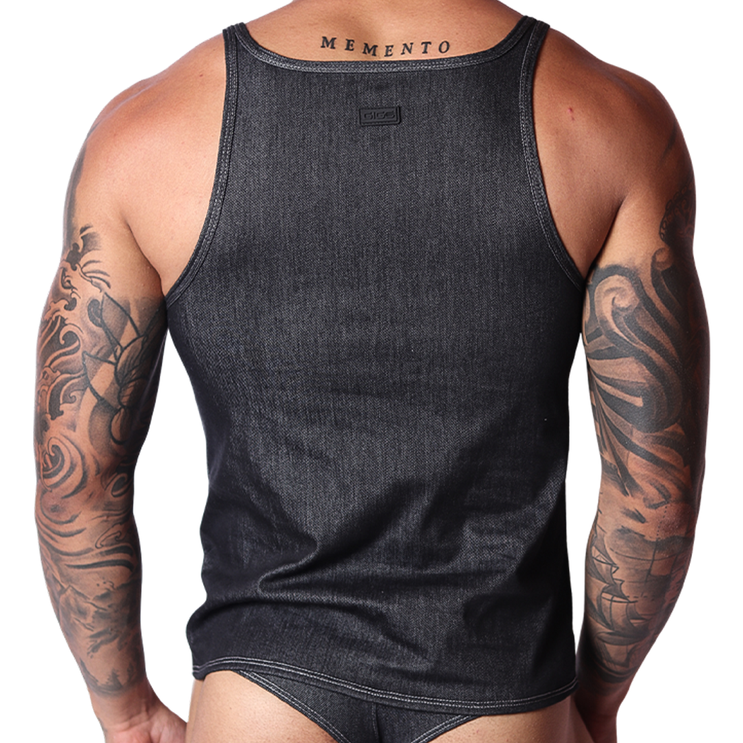 Back view of black denim Gigo tank top with branded tag, modeled on a tattooed man.