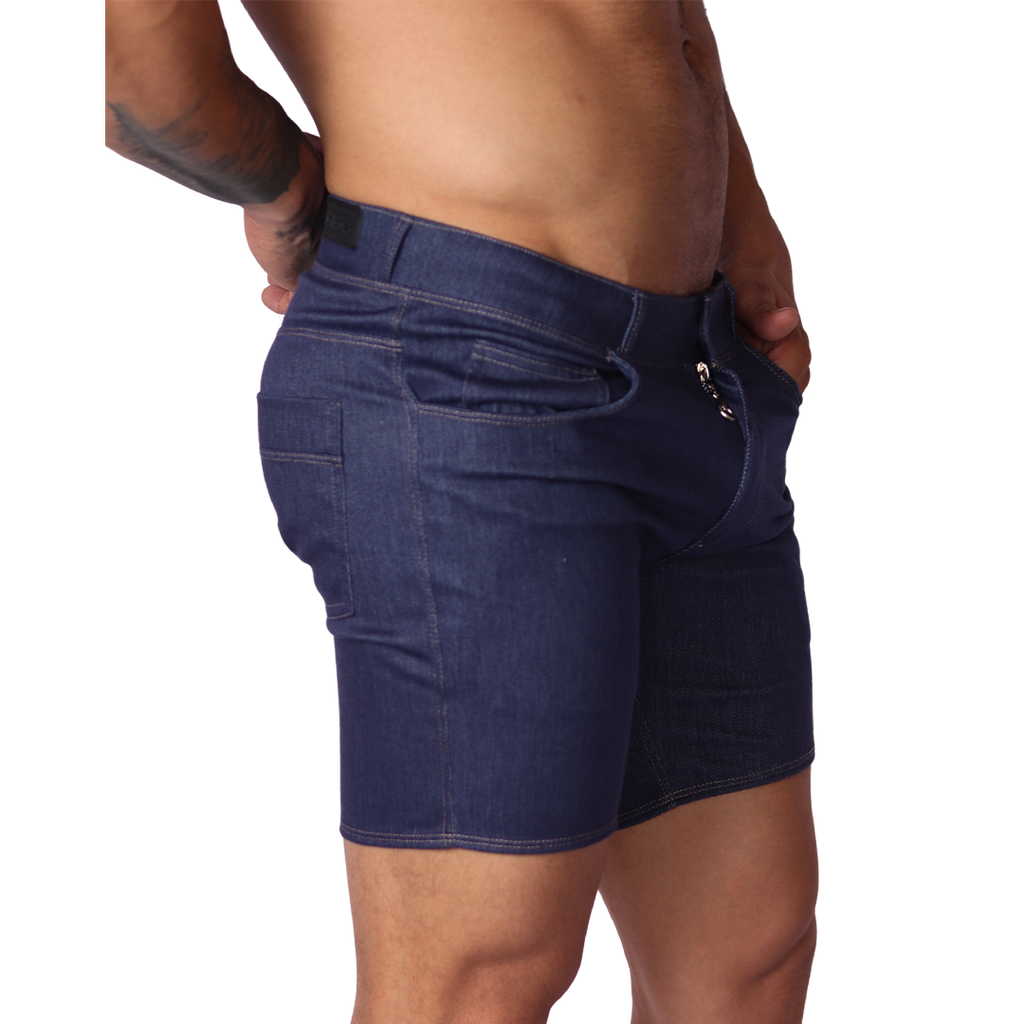 Side view of Gigo blue denim fabric short with silver zipper detail and belt loops on a male model.