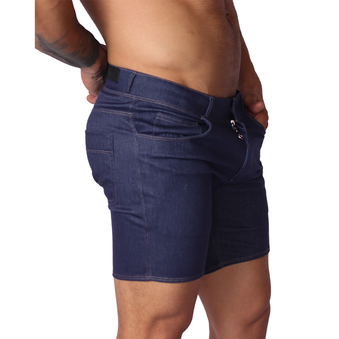 Side view of Gigo blue denim fabric short with silver zipper detail and belt loops on a male model.