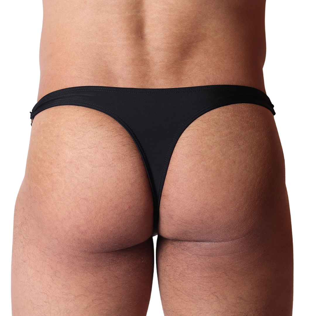 Back view of Gigo Dinamic black swim g-string in smooth fabric featuring minimalist, high-cut design.