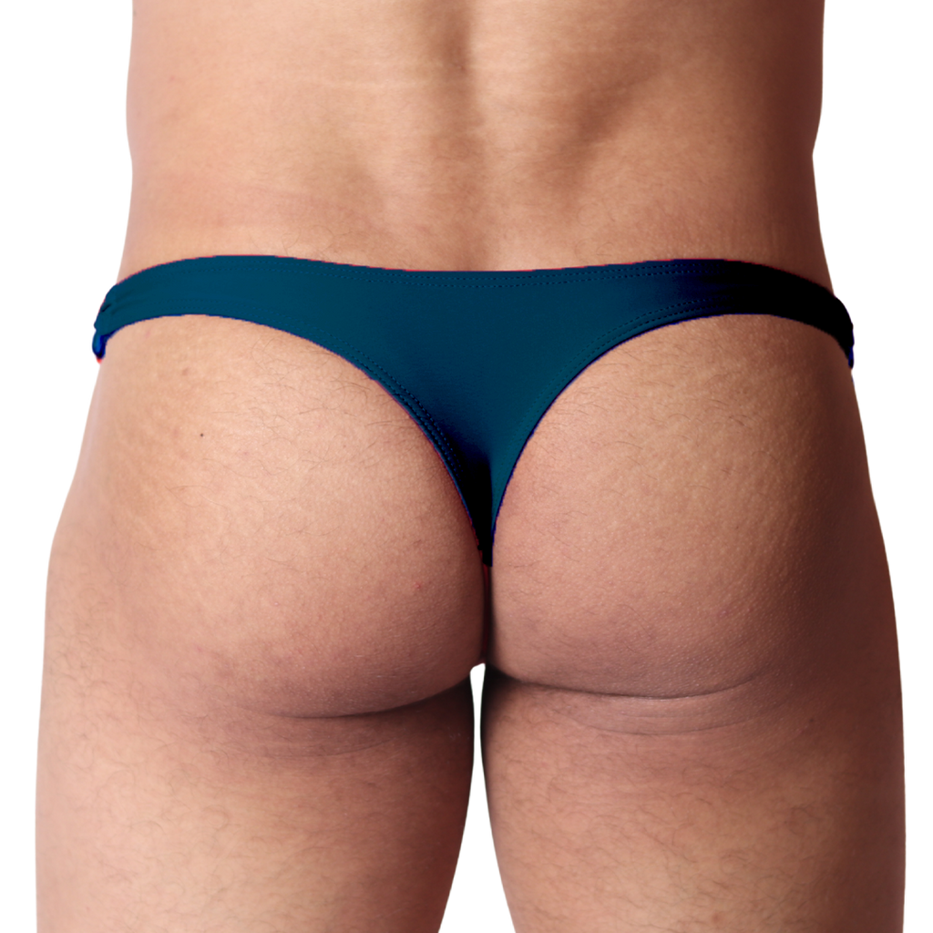 Back view of Gigo Dinamic green swim g-string in smooth, stretchy fabric on a male model.