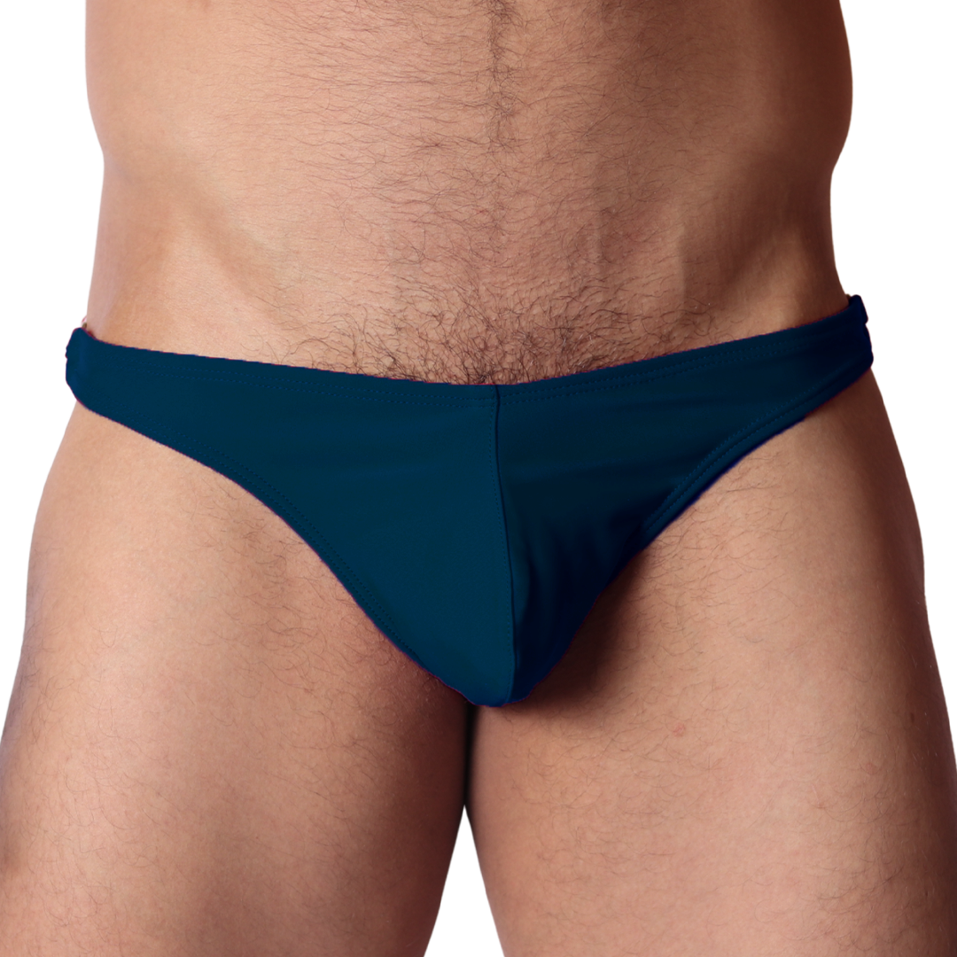 Front view of Gigo Dinamic green swim G-string in smooth, form-fitting fabric with a low-rise waistband.