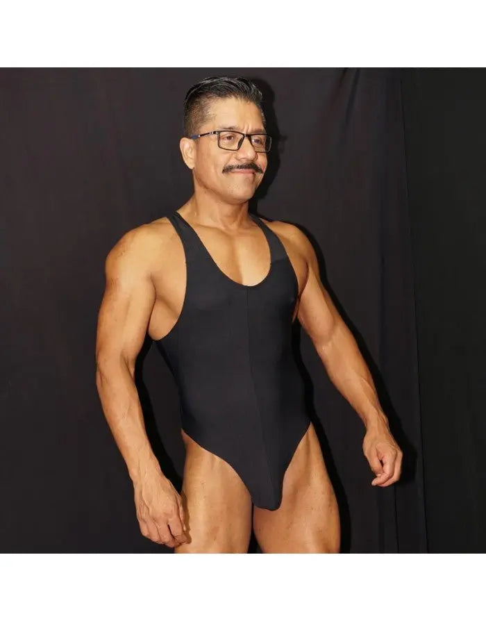 Black microfiber bodysuit thong by Arroyman featuring a sleeveless design and a snug fit modeled by a man.