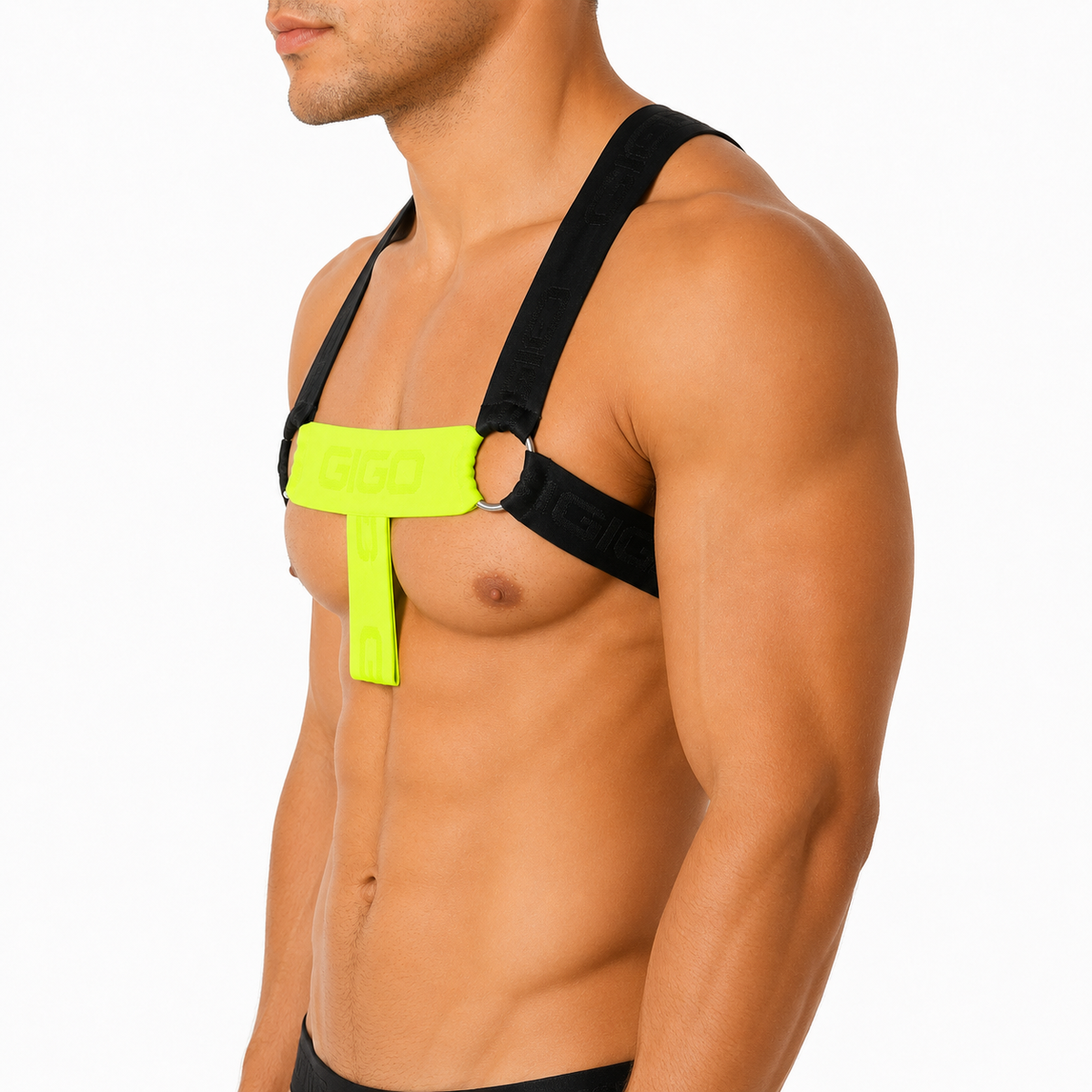 Side view of Gigo Flux neon yellow harness featuring black elastic straps and metallic rings on a muscular model.