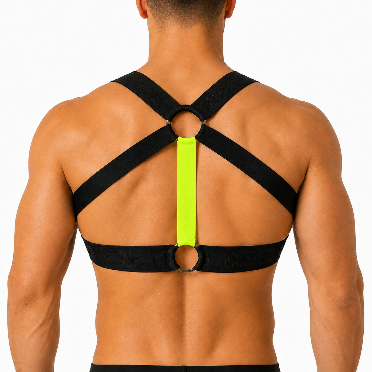 Back view of Gigo Flux yellow and black elastic fabric chest harness with metal ring details on a man.