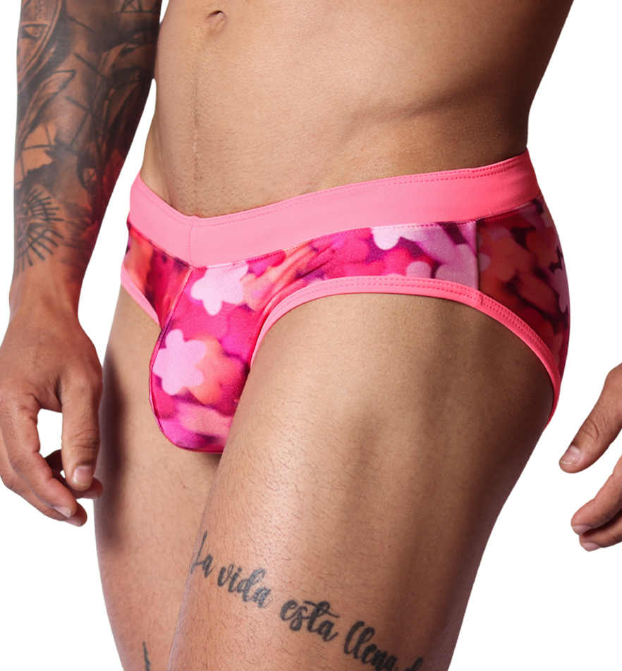 Gigo fuchsia floral print swim brief, side view. Smooth fabric with bright pink waistband and contrast trim.