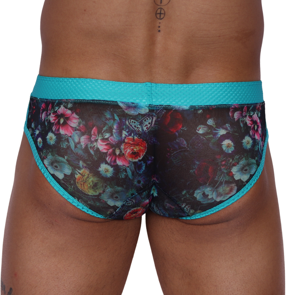 Back view of Gigo Garden Blue brief featuring sheer floral mesh fabric and a textured teal waistband.