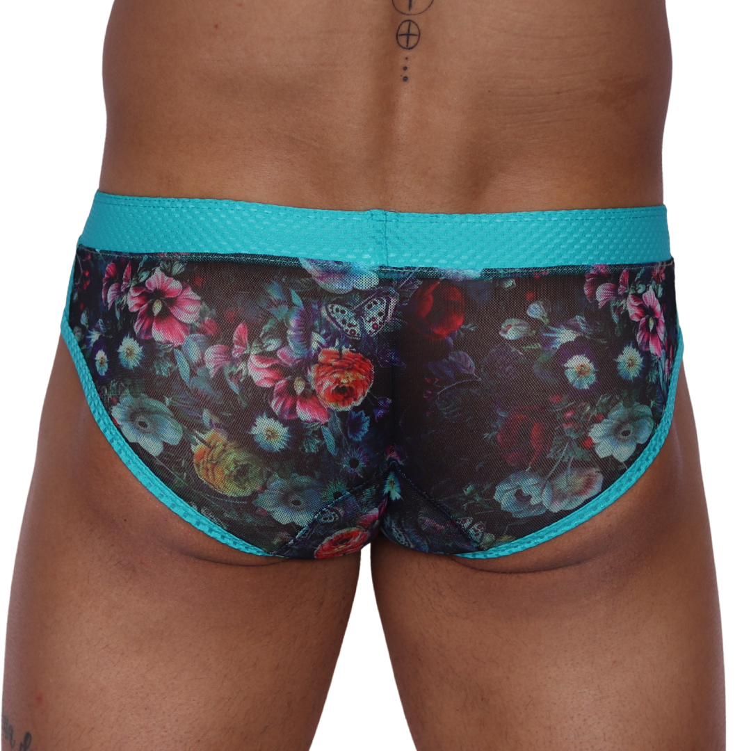 Back view of Gigo Garden Blue brief featuring sheer floral mesh fabric and a textured teal waistband.