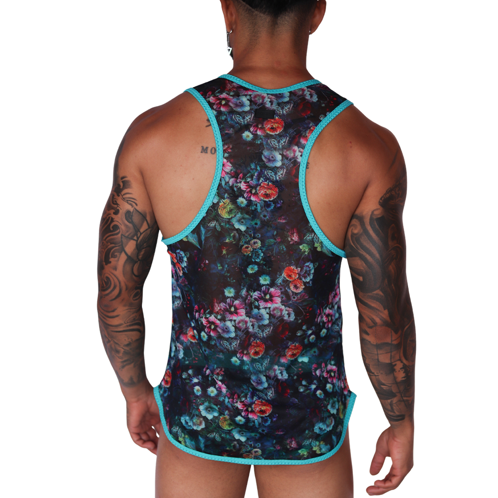 Back view of Gigo Garden Blue sheer mesh tank top with teal trim and vibrant floral print on a tattooed man.