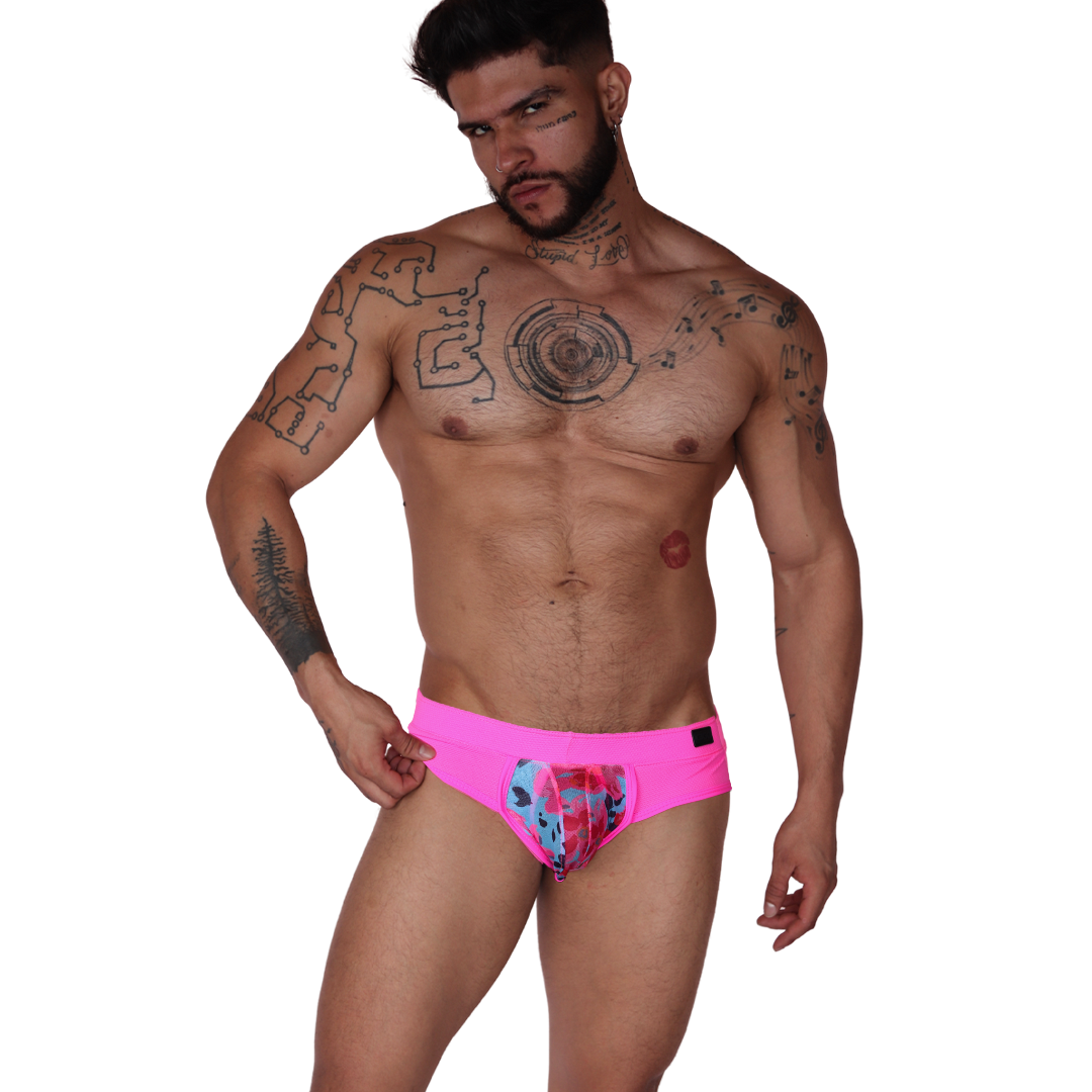 Front view of Gigo Garden fuchsia mesh brief with floral pouch and black label detail on athletic male model.