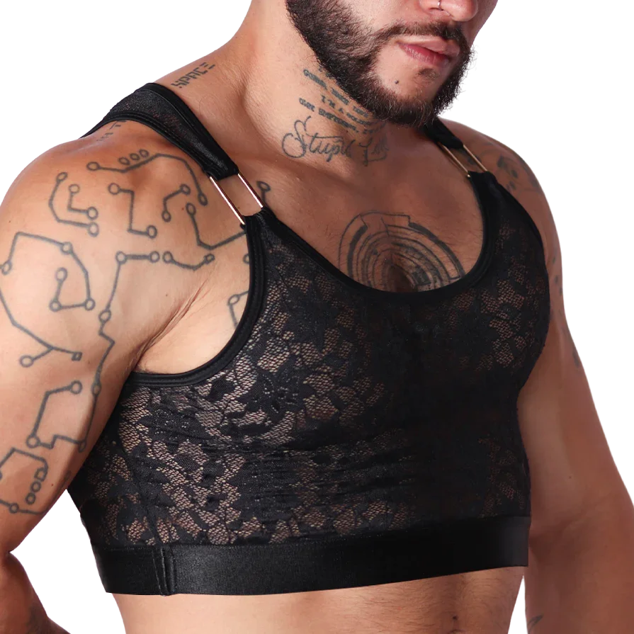 Detail view of Gigo Illusion black lace crop top for men with gold hardware shoulder strap accents.