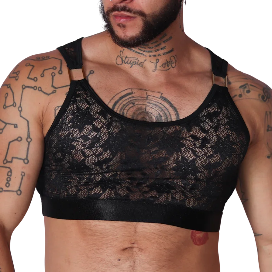Front view of Gigo Illusion black lace crop top with gold rings and elastic band on a tattooed male model.