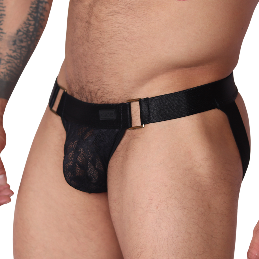 Side view of black Gigo Illusion lace jockstrap with gold ring hardware details on elastic waistband.
